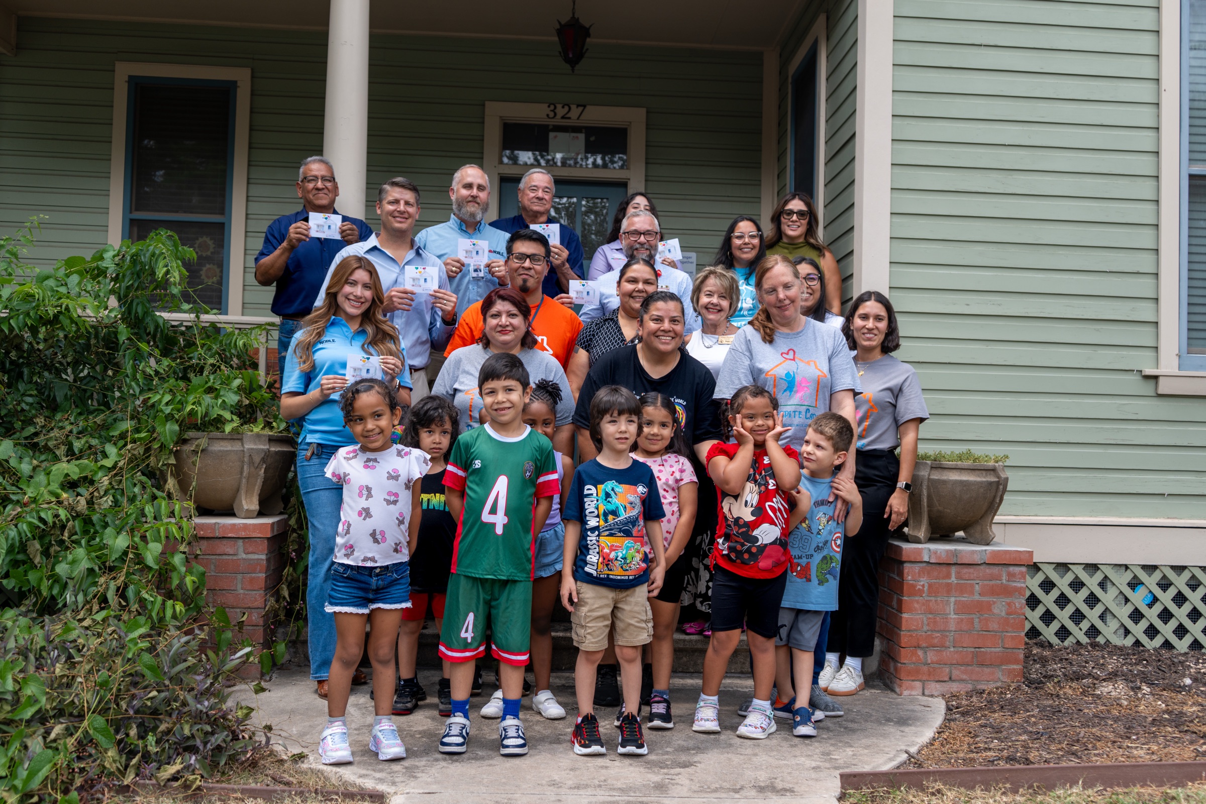 Children, staff, and supporters gathered outside the Respite Care Home for Children in San Antonio