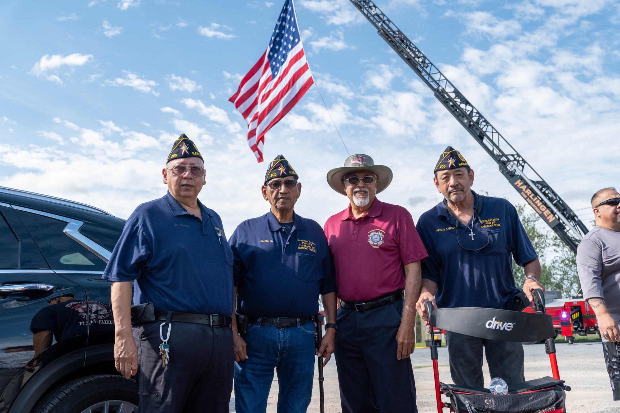 Veterans raise the American flag at the VFW Post 2410 groundbreaking ceremony