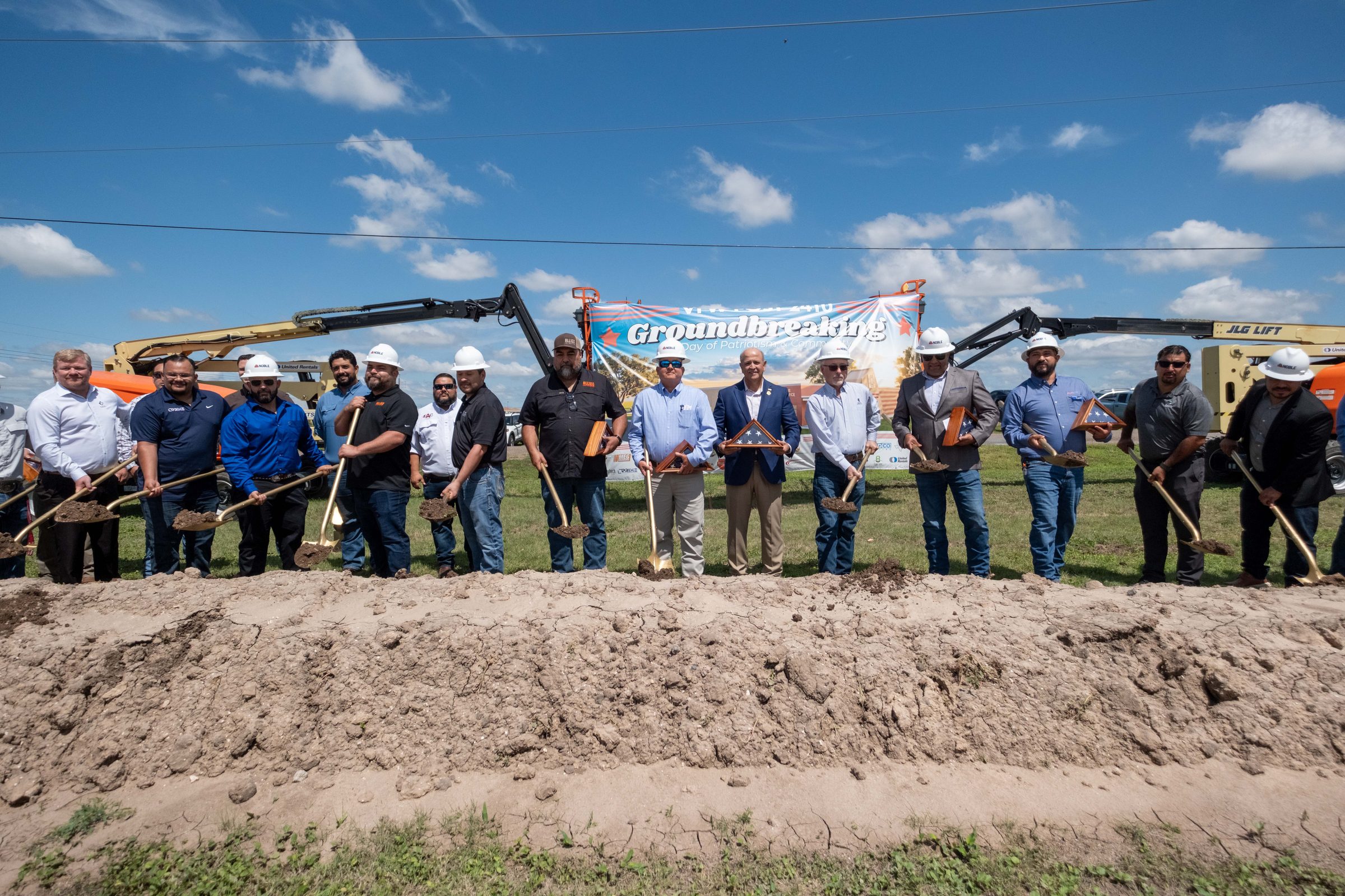 Veterans, officials, and project partners turning the first dirt together at the VFW Post 2410 groundbreaking in Harlingen, Texas